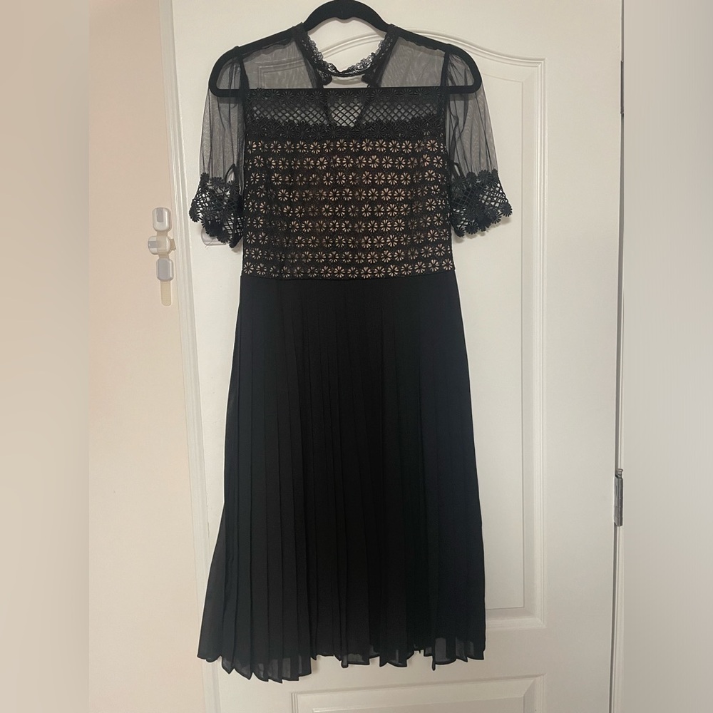 Pleated dress with lace detail and eyelet button back closure